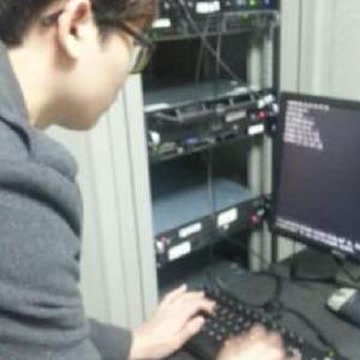 Minhwan Kim working at a server rack